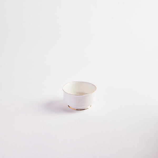 White with gold edges pinch pot.