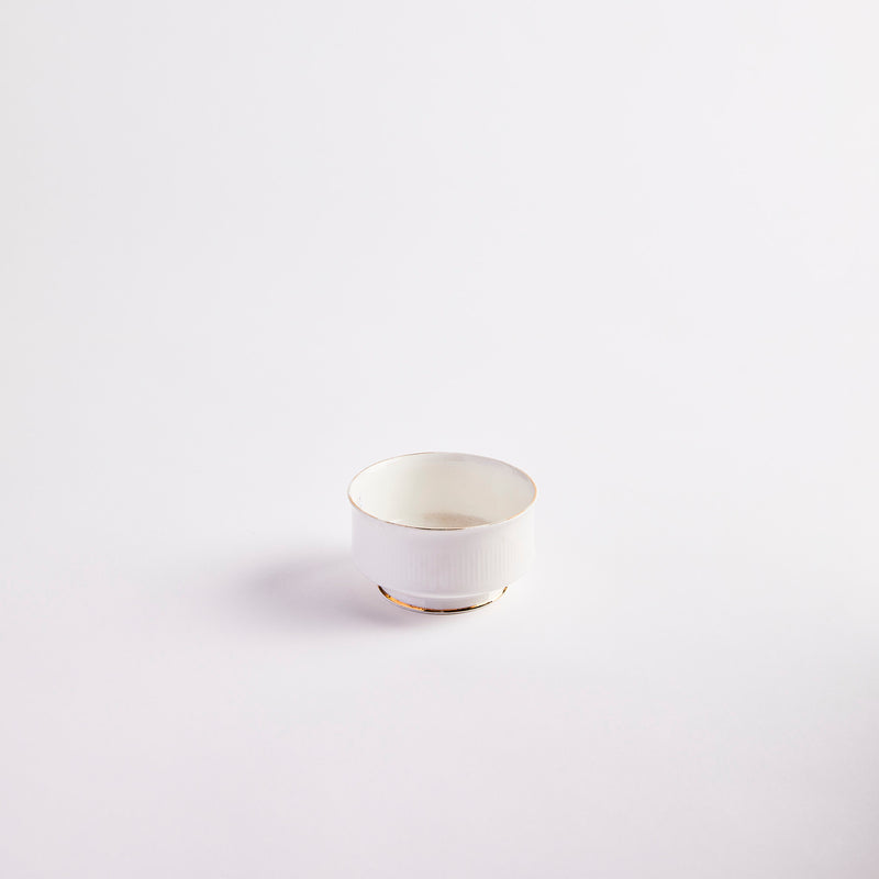 White with gold edges pinch pot.
