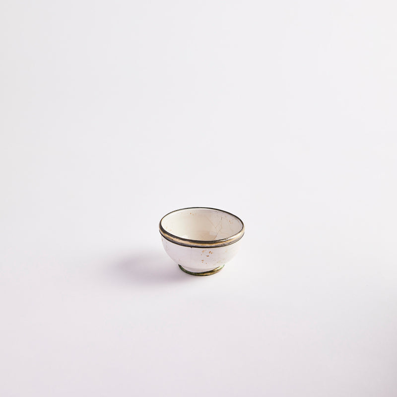 White with antique gold edges pinch pot.