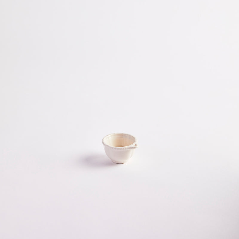 White with single handle pinch pot.