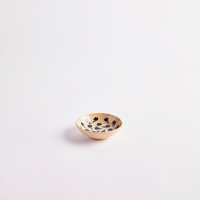 Cream with navy floral detail inside pinch pot. 