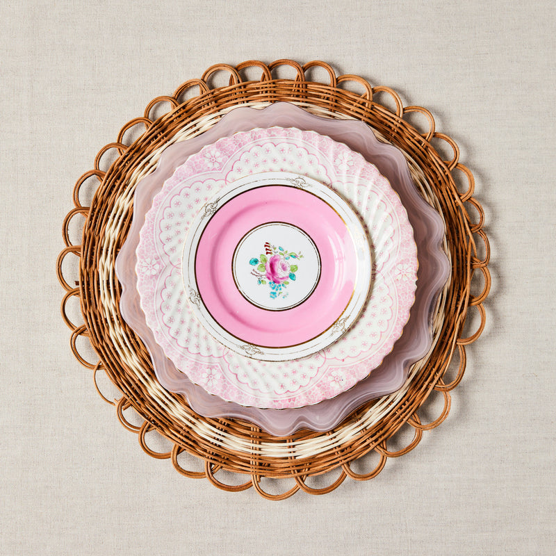 Pink mixed plate set with woven placemat.