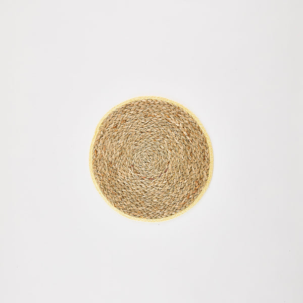 Straw placemat with yellow edge.