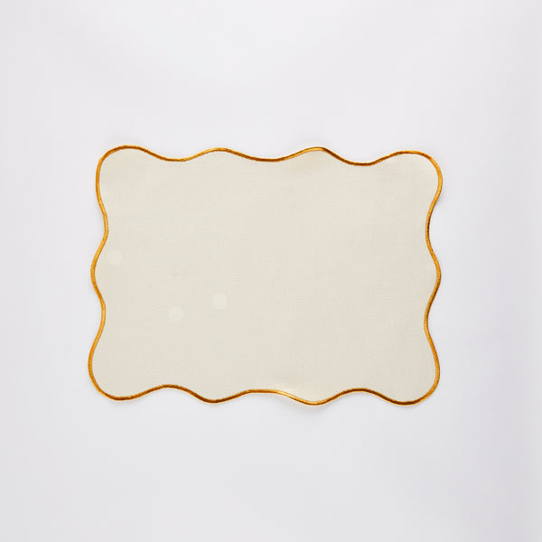 Cream placemat with orange trim.