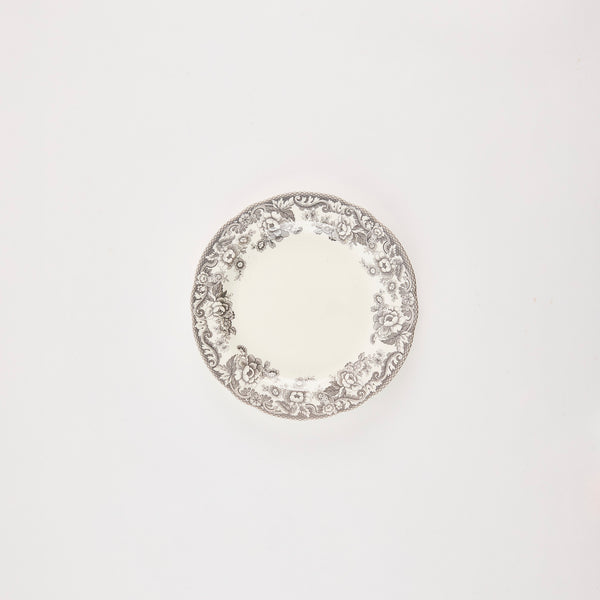 White plate with grey floral detail edge.