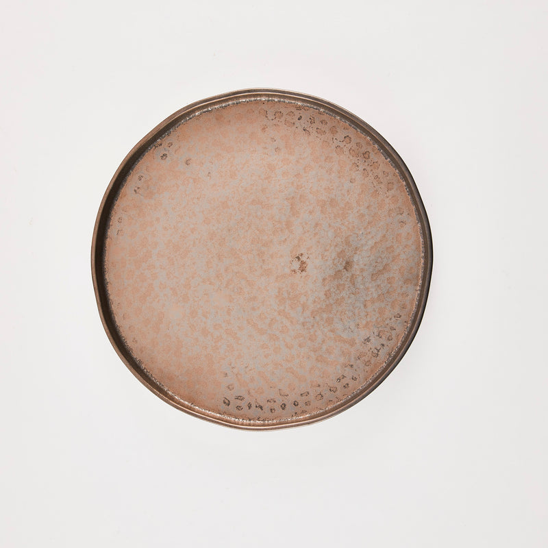 Brown metallic plate.
