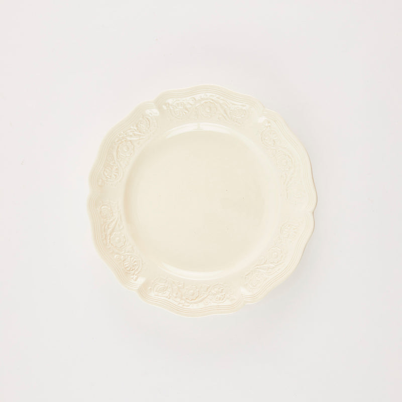 Cream plate with antique edge.
