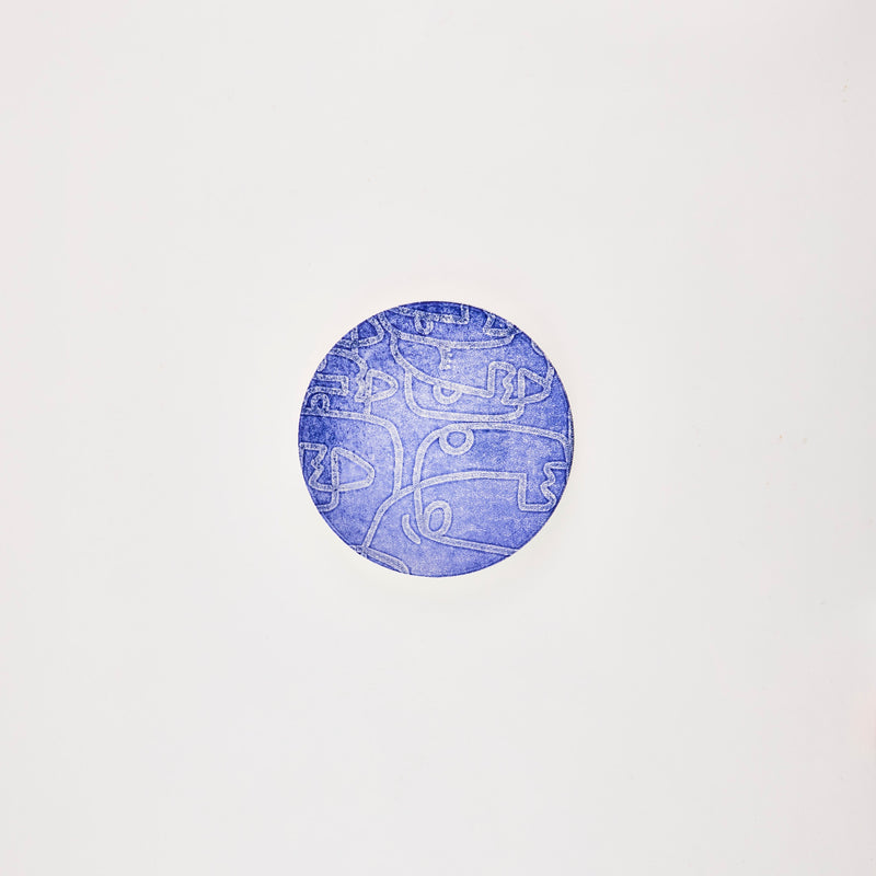 Blue plate with white design.