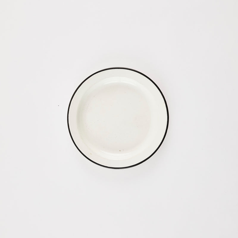 White plate with black rim.
