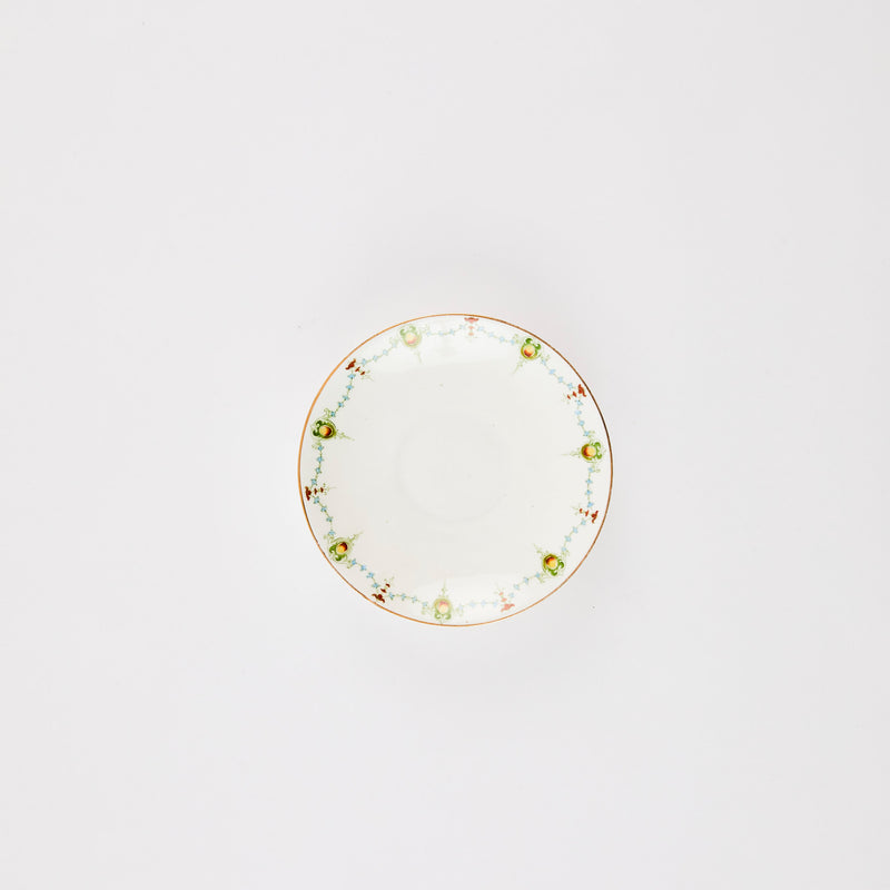 White plate with multicolour decoration edge and gold rim.