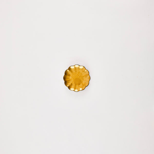 Gold scallop plate.