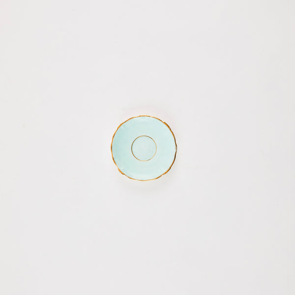 Light blue plate with gold rim.