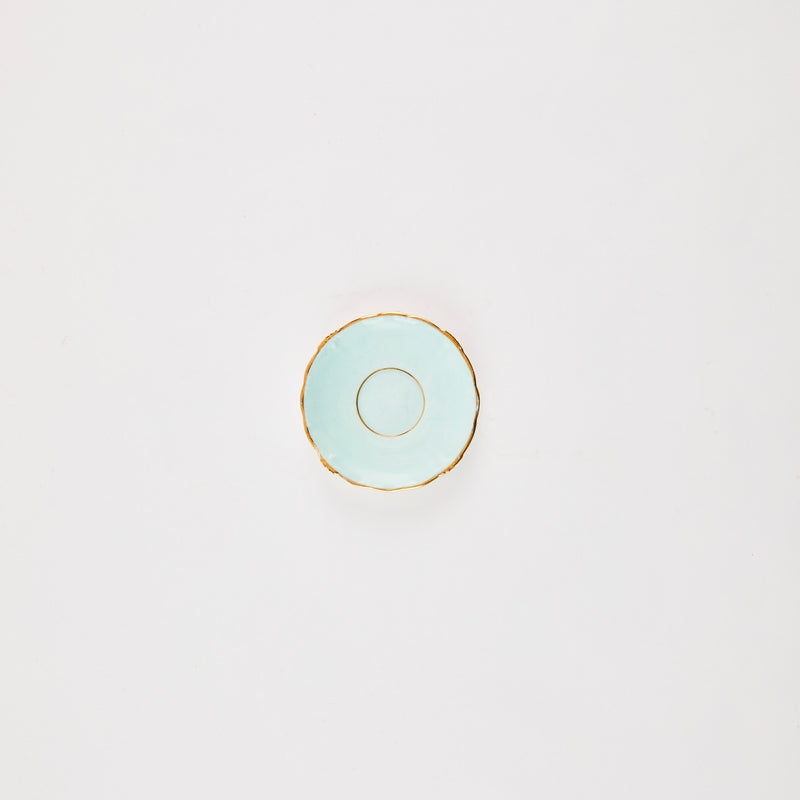 Light blue plate with gold rim.