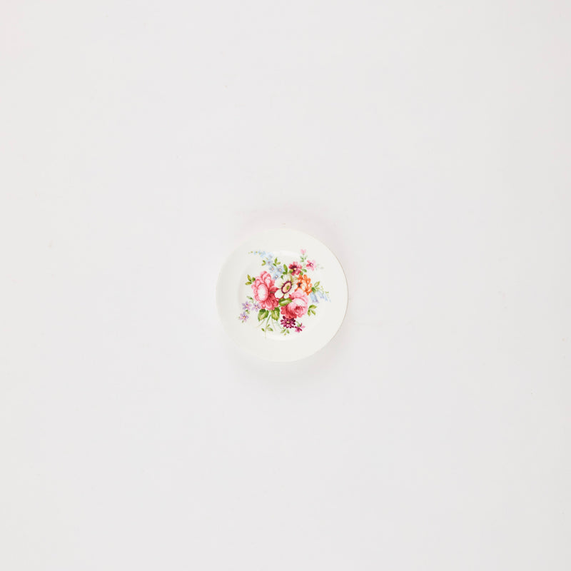 White plate with floral print.