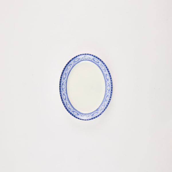 White platter with blue design edge.