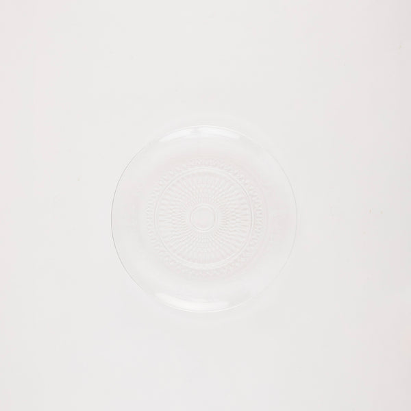 Glass circular platter with embossed design.