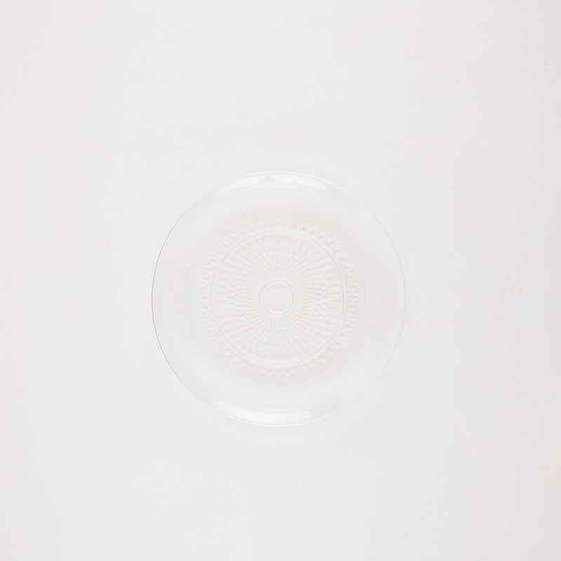 Glass circular platter with embossed design.
