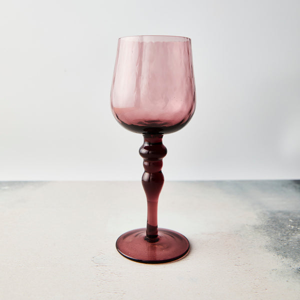 Pink wine glass.