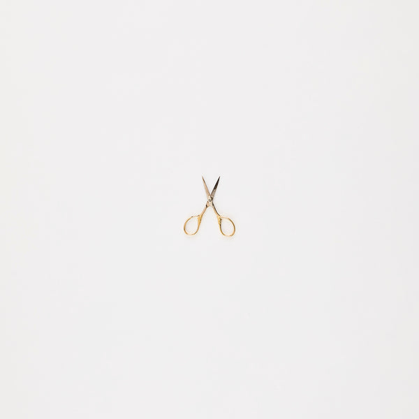 Gold mini scissors.