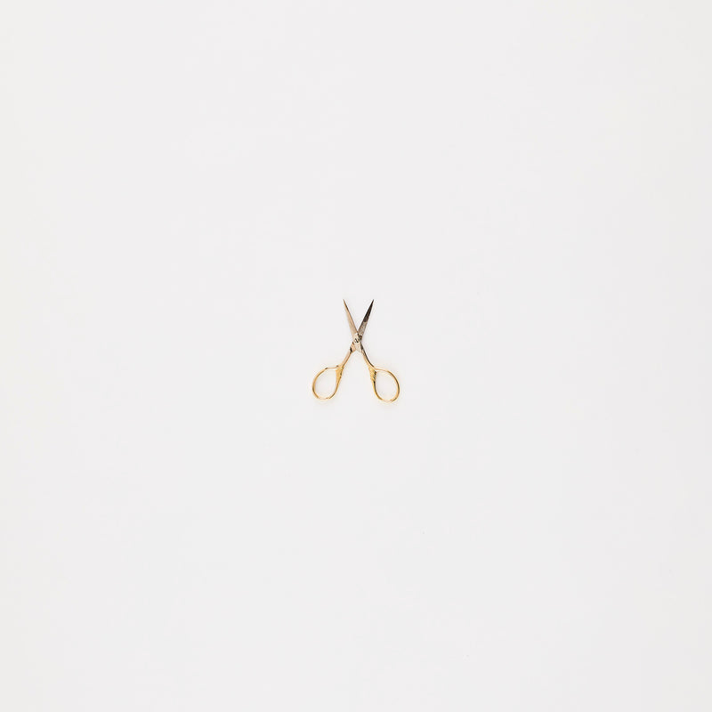 Gold mini scissors.