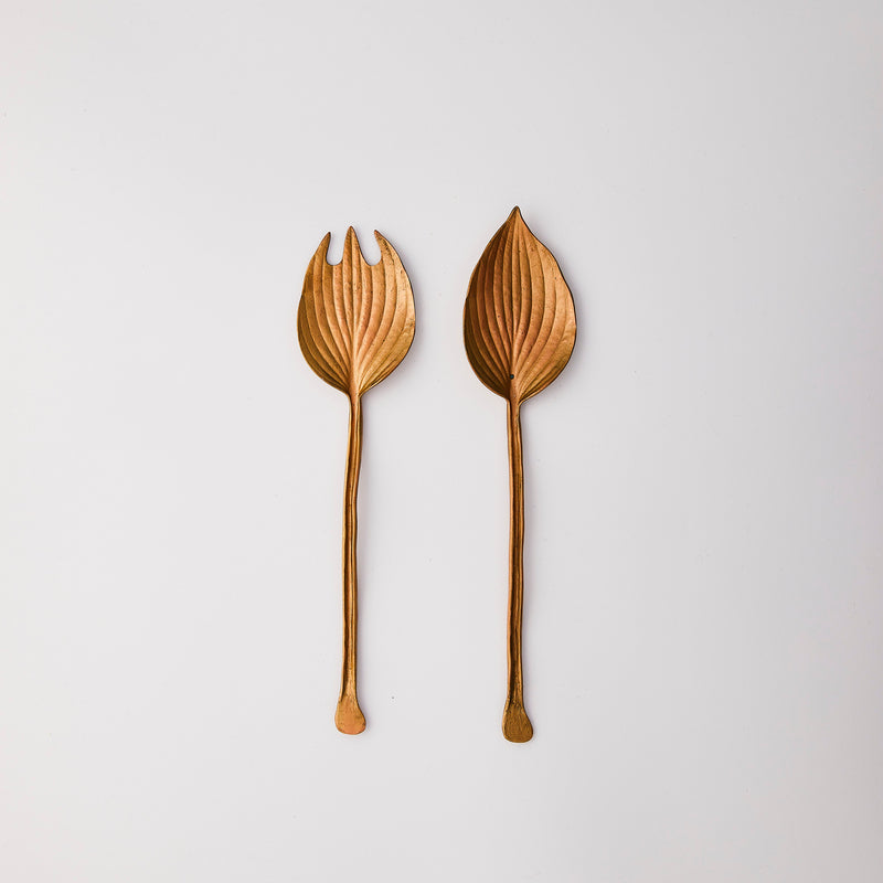 Gold leaf shaped serving cutlery.