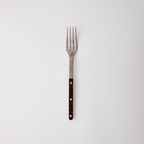 Silver serving fork with tortoise handle.
