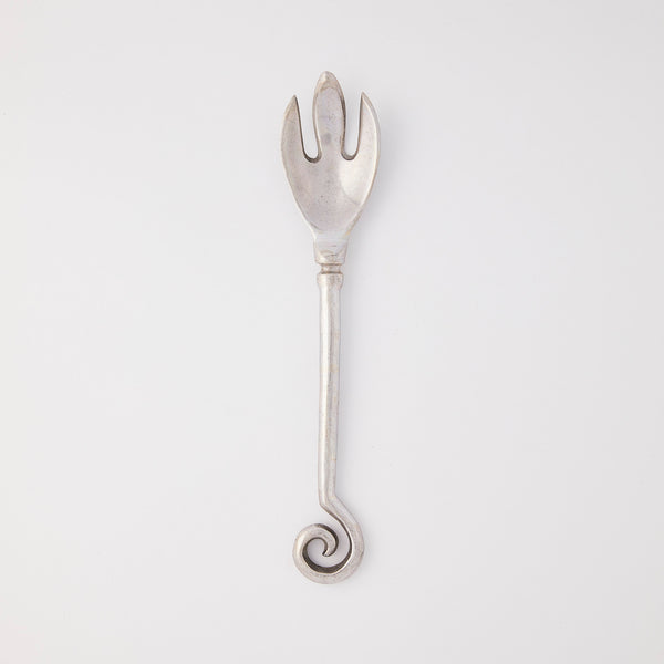Silver serving fork with spiral handle.