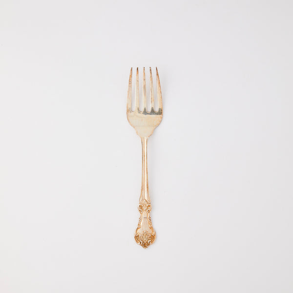 Antique silver serving fork.
