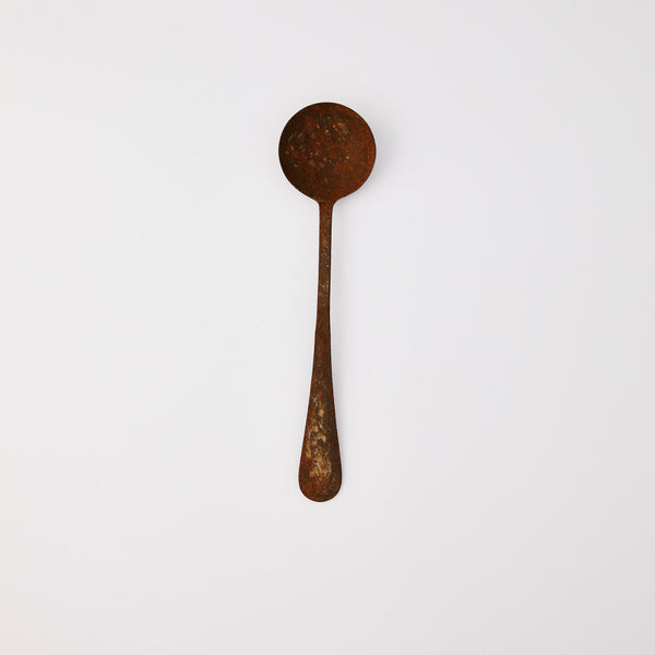 Rusted serving spoon.