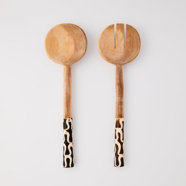 Wooden serving cutlery with animal print handle.