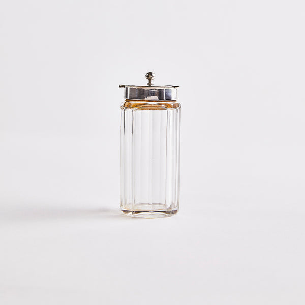 Clear glass with silver top shaker.