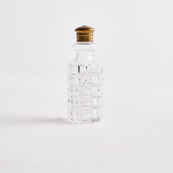 Clear glass with gold top shaker.