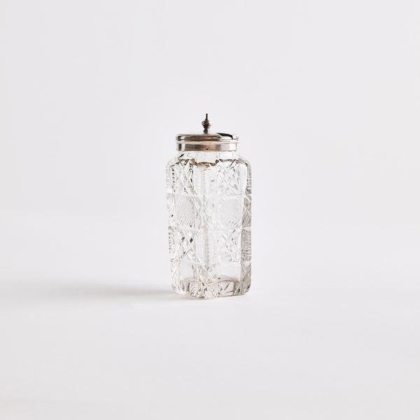 Clear glass with silver top shaker.