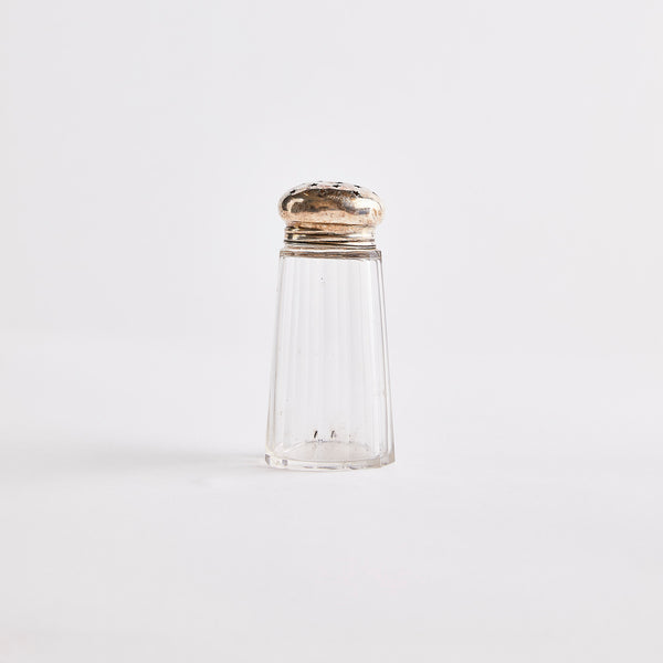 Clear glass with silver top shaker.