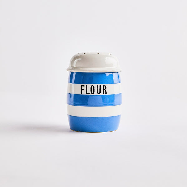 Blue and white striped shaker with flour in black text.
