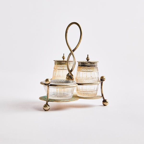 Vintage silver shakers with stand.