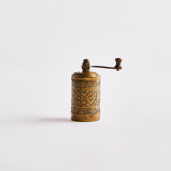 Brass grinder.