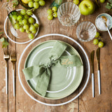 Top view of table setting sounded by grapes and apples on wood table.