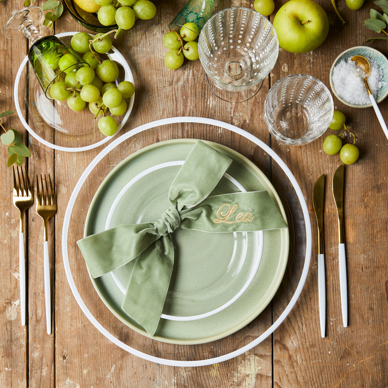 Top view of table setting sounded by grapes and apples on wood table.