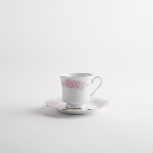 White with pink vintage design tea cup and saucer.