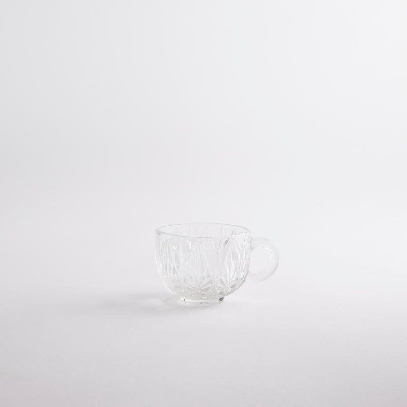 Clear glass textured tea cup.