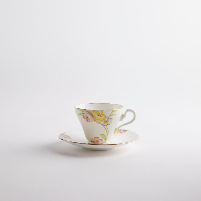 White with multicolour floral design tea cup and saucer.