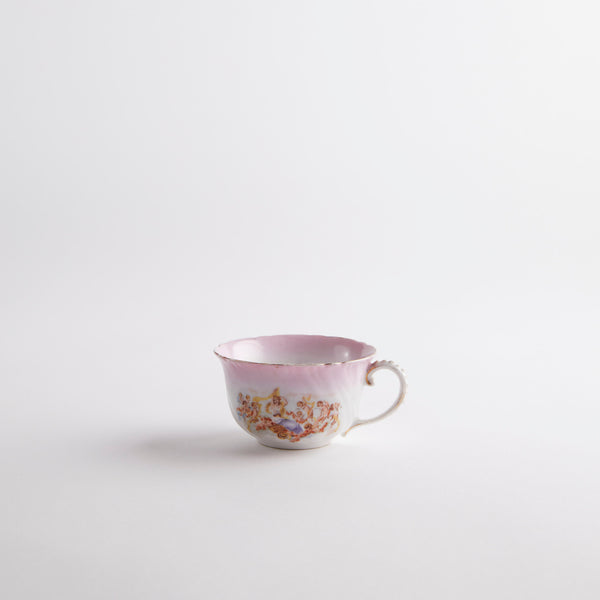 Pink tea cup with vintage design.
