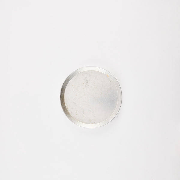 Silver circular tray.