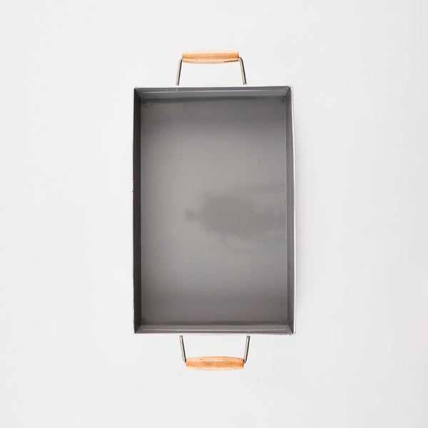 Grey metal rectangular tray with wooden handles.