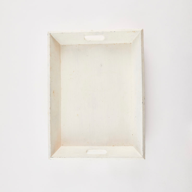 White wooden tray with handles.