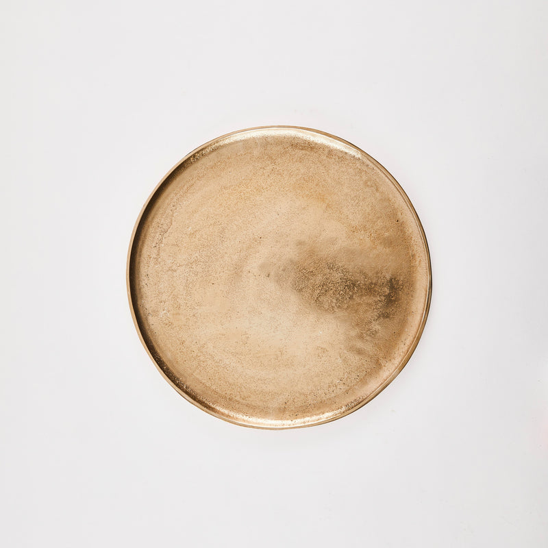 Gold circular tray.