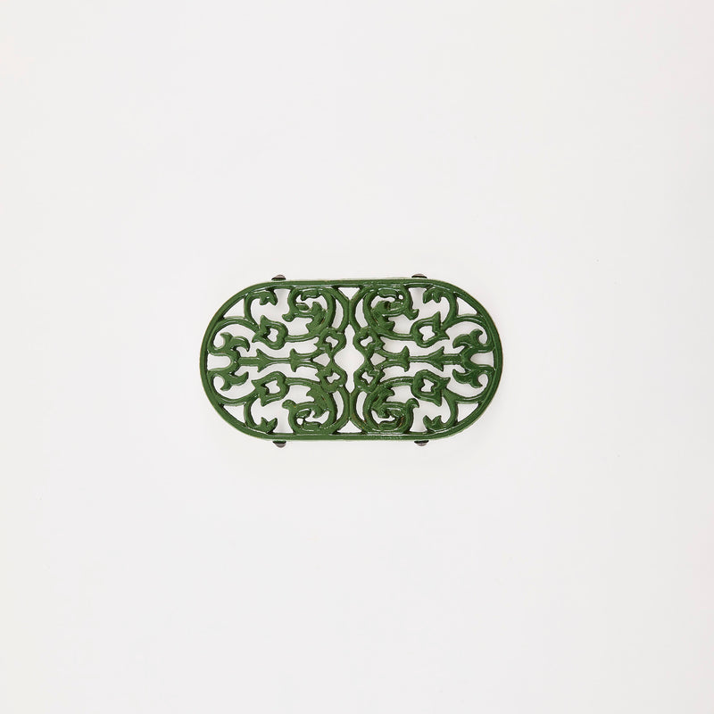 Green decorative trivet.