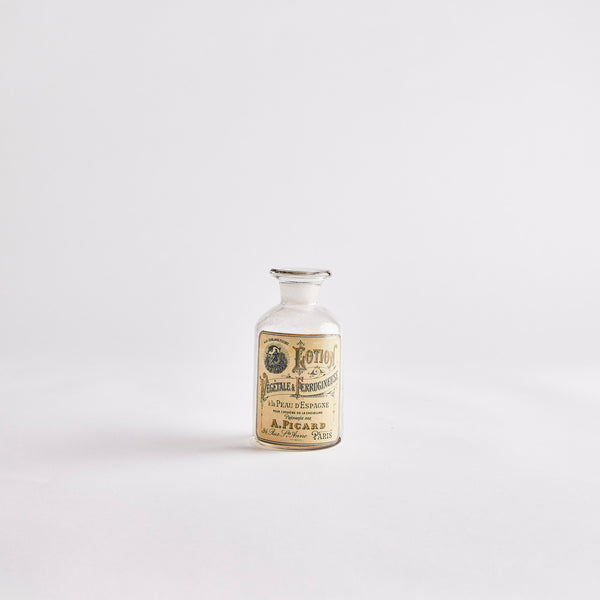 Vintage Bottle with Note in Sand.