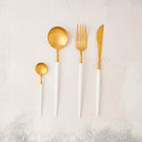Gold with white handle cutlery.